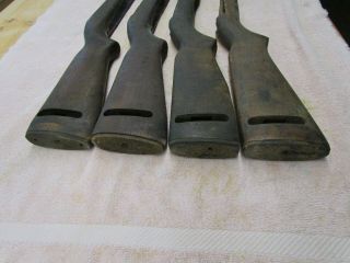 4 USGI US M1 carbine stocks manufacture unknown.  Cracked,  dinged,  scratched WWII 2