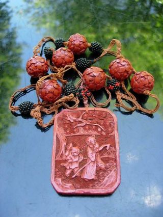 An Antique Chinese Carved Cinnabar Lacquer Pendant & Beads Necklace