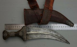 AN ARAB DAGGER (JAMBIYA),  19TH C,  WITH SPECIAL HORN,  AND CURVED BLADE 9