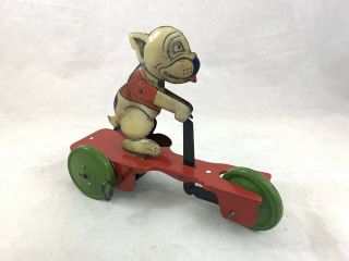 Antique Wind Up Toy Tin Litho Dog On Red Scooter Green Wheels Bulldog
