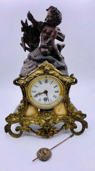 Antique Mantle Clock With Cherubic Figure,  Gilt And Marble Surround.  Poss French