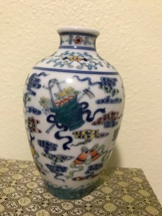 Chinese Porcelain White And Blue Vase W/ Flower Design.