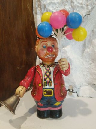 Vintage Clown Tin Toy Japan Wind Up,  Rings Bell,  Holds Balloons