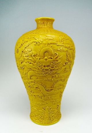 Chinese Antique Yellow Glazed Carved Porcelain Vase With Dragon Pattern