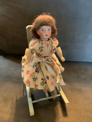 Vintage Mechanical Little Bisque Doll In A Rocking Chair
