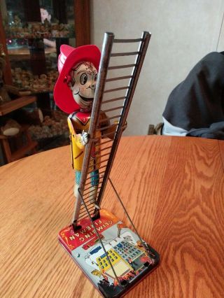 Vintage 1950s Louis Marx Climbing Fireman Wind Up Tin Toy 2