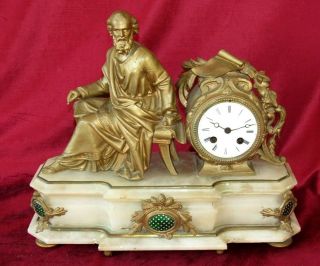 A French Gilt Mantle Clock With Roman/greek Male Figure On Top