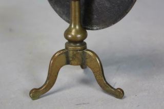 A RARE LATE 18TH C BRASS CANDLE REFLECTOR IN THE SHAPE OF A TILT TOP TEA TABLE 9