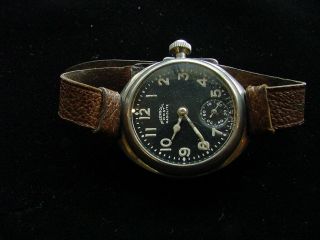 Early Trench Ingersoll Wristwatch,  Radiolite.  Black Dial.  Leather Band.