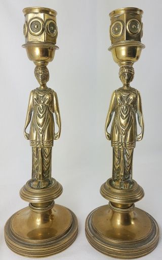 A Antique Brass French Lady Candle Sticks.
