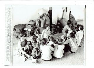 Vietnam War Press Photo - Refugees Huddle Together - Hue