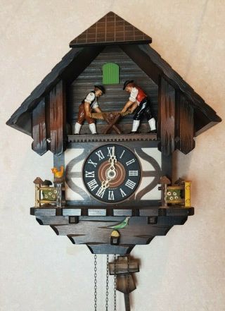 Vintage Black Forest Chalet Cuckoo Clock With Moving Bucksaw Men