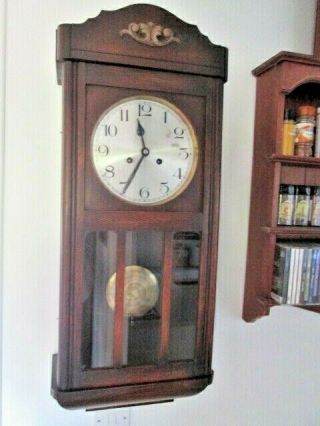 An Oak 1930s 40s Chiming Wall Clock