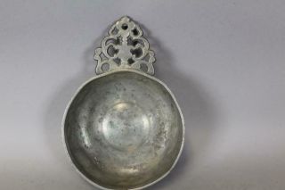 18TH C PEWTER PORRINGER WITH A FULLY DEVELOPED CUT AND DECORATED HANDLE 2