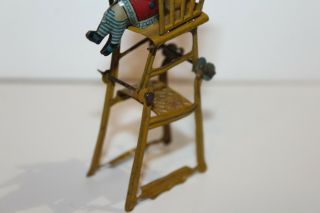 EARLY 1900 ' s GERMAN TIN LITHO CHILD IN HIGH CHAIR PENNY TOY 4