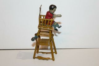 EARLY 1900 ' s GERMAN TIN LITHO CHILD IN HIGH CHAIR PENNY TOY 6
