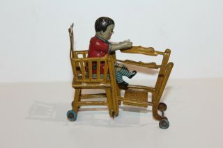 EARLY 1900 ' s GERMAN TIN LITHO CHILD IN HIGH CHAIR PENNY TOY 8