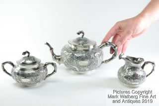 Chinese Export Silver Repoussé Three Piece Tea Service,  Dragons,  19th Century