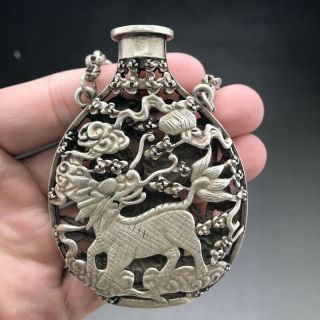 A phoenix image of a silver snuff bottle carved by hand in ancient Tibet 5