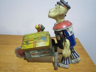 VINTAGE MARX POPEYE EXPRESS WIND UP TIN TOY FIXED PARROT and Pop UP PARROT 10