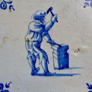 Antique Delftware tile with a blacksmith at work,  Delft 17th.  century 2