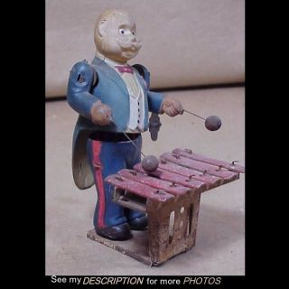Antique Occupied Japan Tin & Celluloid Man Playing Xylophone Wind Up Toy