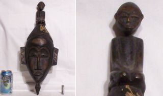 Very Old Carved Wooden Baule Portrait Mask With A Small Figure Kneeling On Top