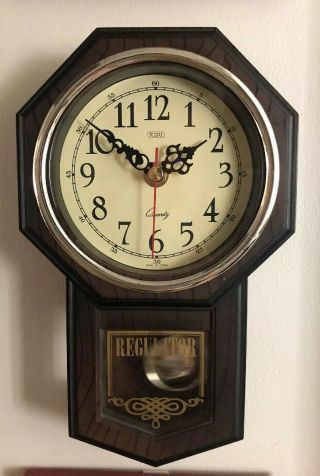 Vintage Tozai Regulator pendulum wall clock.  Rare mini clock.  great 2