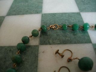 A vintage graduated jade bead necklace with matching earrings 5
