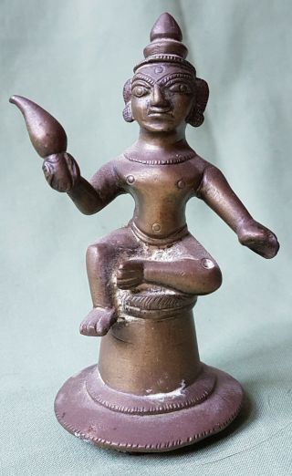 19th Century Indian Brass Figure Holding A Lamp Or Torch
