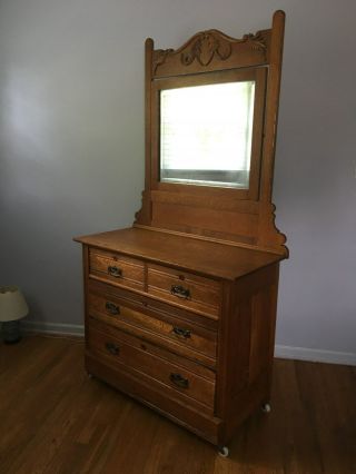 Antique Oak Dresser With Swivel Beveled Mirror