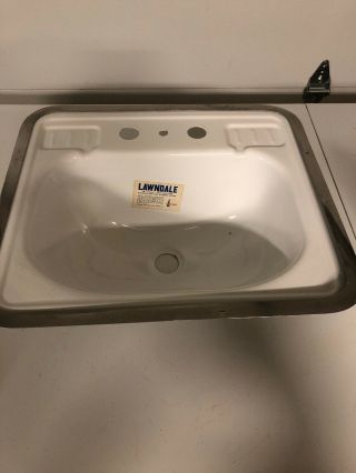 Lawndale Porcelain Sink.  Nos Still Bears Label And Comes With Trim Ring