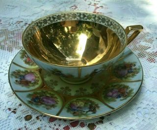 Gold / Gilt Hand Painted Love Story Western Germany Tea Cup / Teacup & Saucer