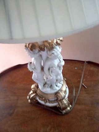 Antique French Porcelain,  Bisque Cherub table lamp/ gold gilt,  signed,  numbered 2