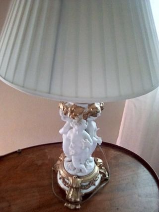 Antique French Porcelain,  Bisque Cherub table lamp/ gold gilt,  signed,  numbered 4