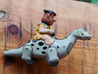 VINTAGE FLINSTONES TIN WIND UP TOY MARX FRED RIDING DINO EXTREMELY RARE.  1962 2