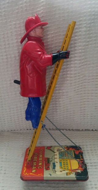 Vintage Marx Wind Up Climbing Fireman.  Mechanism.  Tin Litho Base.