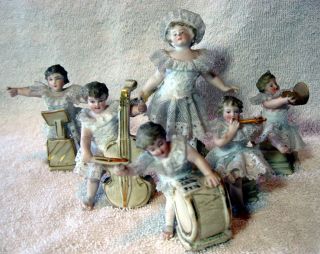 A Set Of 6 Antique German Bisque Porcelain Lace Band Playing Figurine