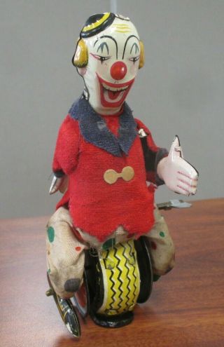 Vintage T.  P.  S.  Japan Tin Litho Wind Up Circus Clown On Unicycle
