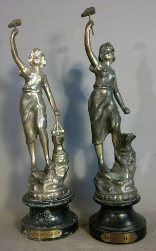 (2) Antique French Women In Industry Old Lady Hammer & Anvil Industrial Statue