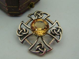 An Antique Scottish Made Celtic Knot Silver Brooch.  Set With A Cairngorm Citrine