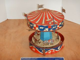 VINTAGE WOLVERINE TIN MERRY GO ROUND CAROUSEL,  RESTORATION,  REPAIR 2