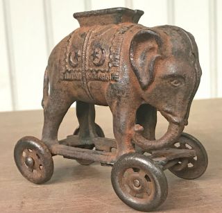 Antique A.  C.  Williams Rolling Elephant Toy Cast Iron Bank With Wheels