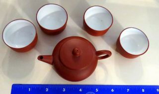 Miniature Chinese Yixing Red Clay Teapot And 4 White Enamel Lined Mini Cups