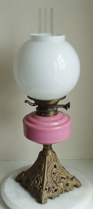 Vintage Youngs Oil Lamp With Pink Glass Bowl And White Shade On A Cast Iron Base