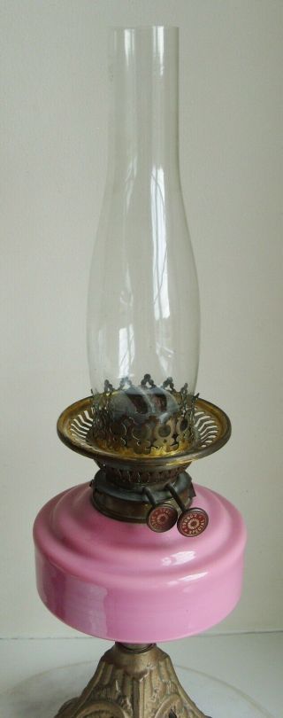 Vintage Youngs Oil Lamp with pink glass bowl and white Shade on a cast iron base 3