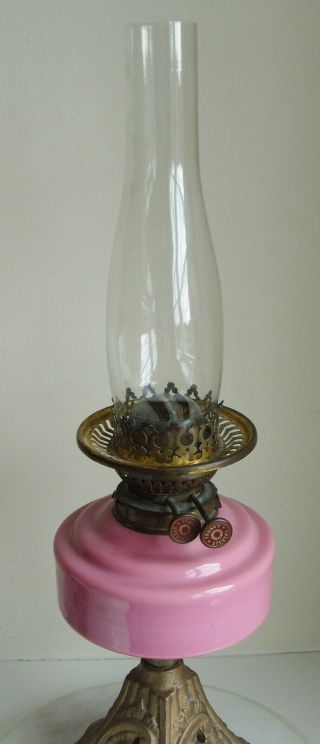 Vintage Youngs Oil Lamp with pink glass bowl and white Shade on a cast iron base 4