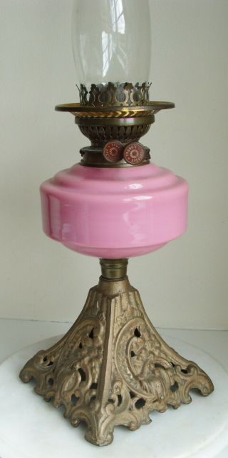 Vintage Youngs Oil Lamp with pink glass bowl and white Shade on a cast iron base 5