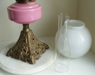 Vintage Youngs Oil Lamp with pink glass bowl and white Shade on a cast iron base 8