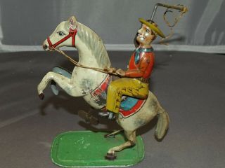 Early German Tin Wind Up Lasso Cowboy On Horse Toy K 946